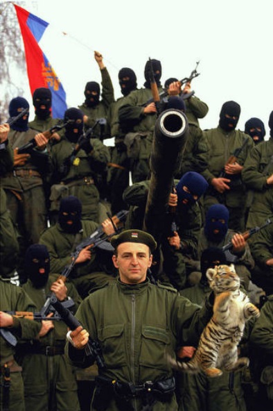 Zeljko Raznatovic, known as Arkan, poses with his paramilitary unit the Tigers. Arkan's Tigers were responsible for part of the ethnic cleansing during the Bosnian war (1991) © Ron Haviv - VII