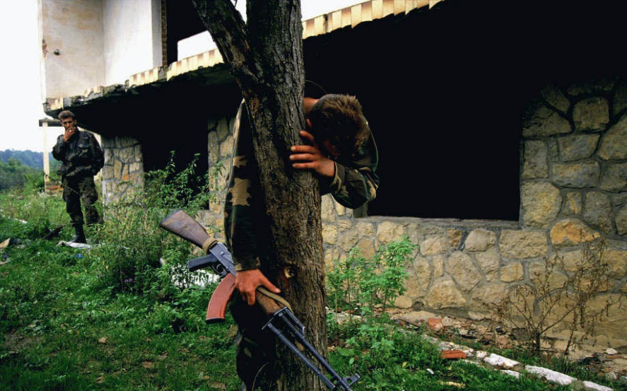 The only survivor of a massacre finds his home in ruins after the Bosnian army recaptured his village from Serb forces in 1995 (1995) © Ron Haviv - VII